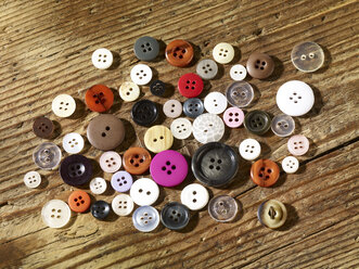 Collection of different buttons on wood - SRSF000578