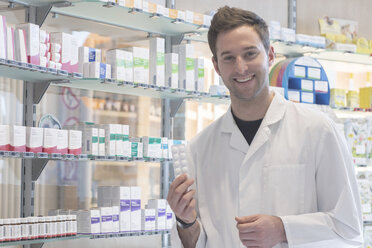 Portrait of smiling pharmacist in pharmacy - SGF001351