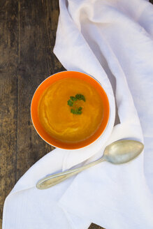 Bowl of carrot soup, spoon and napkin - LVF002917