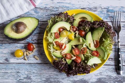 Dish of avocado tomato salad stock photo