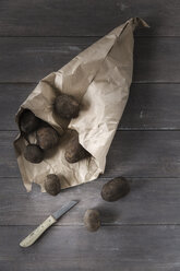 Blue Congo potatoes on paper bag - EVGF001264