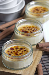 Cinnamon sticks and glasses of Creme Brulee - YFF000320