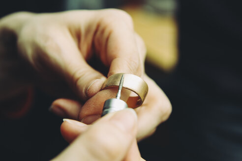 Goldsmith working on wedding rings - KRPF001323