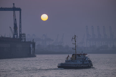 Germany, Hamburg, sunset at container harbor - HLF000840