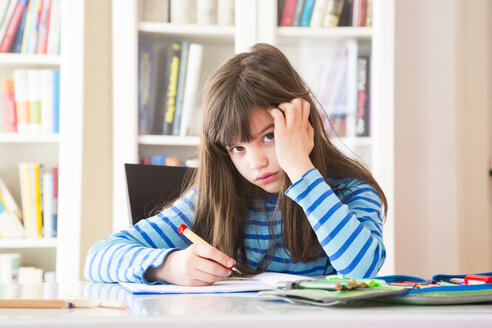 Frustrated girl doing homework - LVF002964