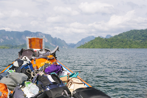 Thailand, Khao Sok National Park, backpacks in longtail boat stock photo