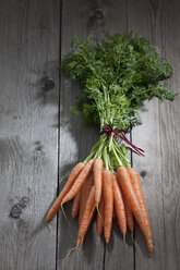 Bunch of carrots on wood - CSF024721