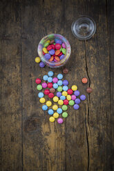 Smarties, candy jar and glass cover on wood - LVF002983