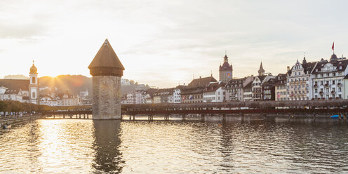 Switzerland, Canton of Lucerne, Lucerne, Old town, Reuss river, Chapel bridge and water tower at sunset - WDF002968