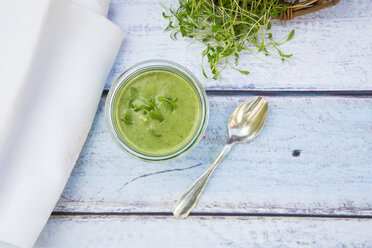 Cress soup in glass on wood - LVF002991