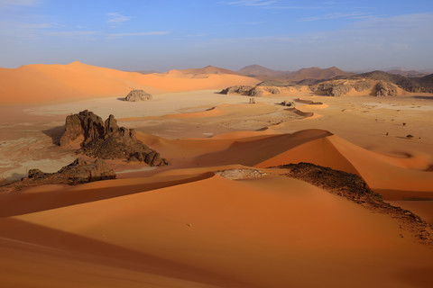 Africa, Algeria, Sahara, Tassili N'Ajjer National Park, Tadrart region, sand dunes and clay pan of southern Oued in Tehak stock photo
