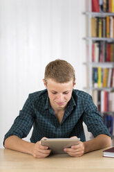 Teenage boy using digital tablet - DRF001476