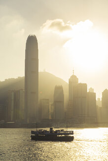 China, Hong Kong skyline from the sea at sunset - GEMF000107