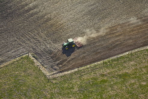 Germany, Bavaria, Aerial view of tractor on field - KDF000695