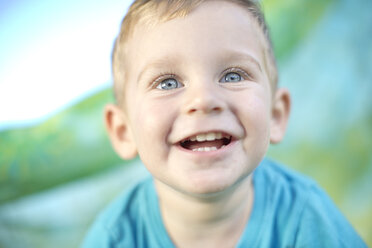 Portrait of smiling little boy outdoors - ZEF003765