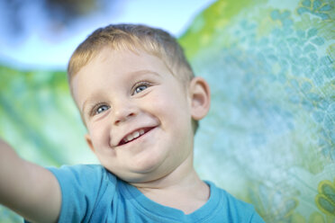 Portrait of smiling little boy outdoors - ZEF003766