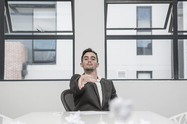 Businessman in meeting room pointing his finger - ZEF004536