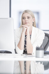 Businesswoman in office at desk - ZEF004637