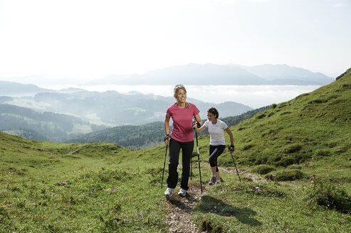 Austria, Two women Nordic walking at Kranzhorn - MAOF000070