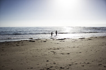Namibia, Swakopmund, two boys playing at seafront - GSF001006