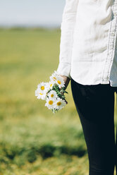 Cropped view of woman with flowers outdoors - JPF000027