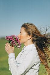 Woman with flowers outdoors - JPF000028