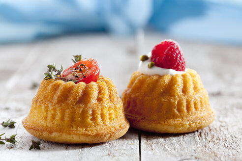 Two mini Gugelhupf filled with cream cheese and ricotta garnished with tomato and raspberry - CSF024929