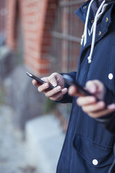 Hand of teenage boy with smartphone - MMFF000512