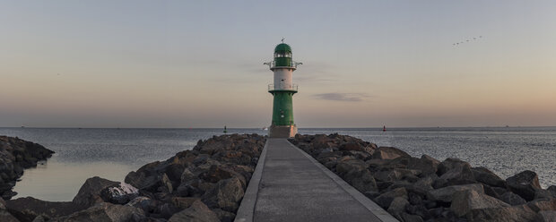 Germany, Warnemuende, lighthouse at dawn at the Baltic Sea - MELF000047