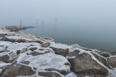 Germany, Thurgau, Altnau, Lake Constance, Port entrance in morning mist - KEBF000067