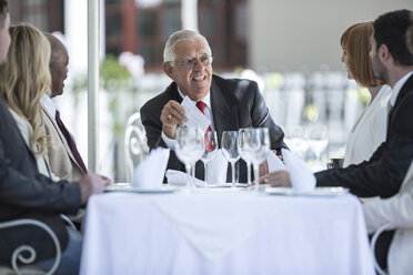 Business people having business lunch in restaurant - ZEF004132