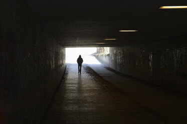 Person walking in tunnel - CRF002655