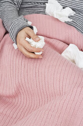 Close-up of sick woman with tissues - MAEF009935