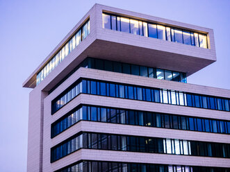 Germany, Hamburg, modern office building at Hafencity at dusk - KRPF001353