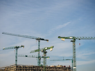 Germany, Hamburg, cranes on construction site - KRPF001378
