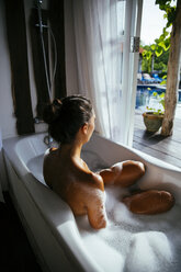Woman relaxing in bathtub - MBEF001337