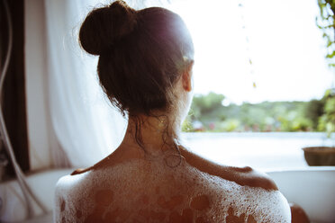 Woman relaxing in bathtub - MBEF001339