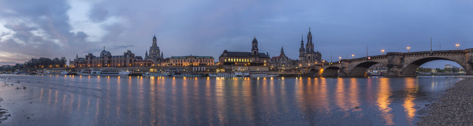 Germany, Dresden, view to lighted city with Elbe River in the foreground in the morning - PVCF000350