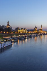 Germany, Dresden, view to lighted old city with Elbe River in the foreground in the evening - PVCF000351