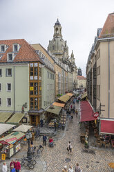 Germany, Dresden, view to shopping street with Dresden Frauenkirche in the background - PVCF000328