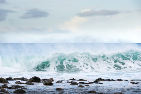 Norway, Lofoten, Utakleiv, surging billow at waterfront stock photo