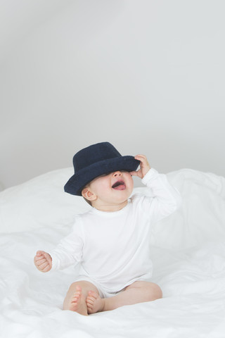 Baby girl with oversized hat stock photo