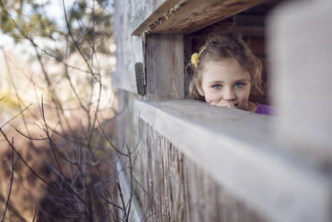 Girl looking out of tree house - OPF000051