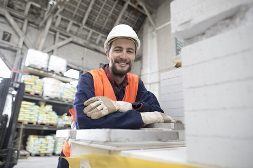 Smiling warehouseman in storehouse - SGF001422
