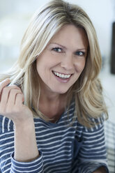 Portrait of smiling blond woman - MAEF010000