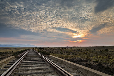 South America, Argentina, Patagonia, Province Rio Negro, near Nirihuau, Railway track at sunset - STSF000700