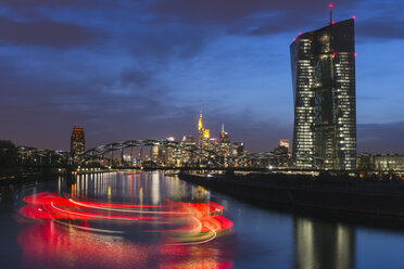 Germany, Frankfurt, city view with European Central Bank and turning ship on Main river at twilight - KEBF000088