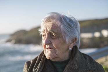 Spain, Galicia, Ferrol, Portrait of an old woman at the coast - RAEF000110