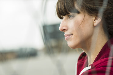 Portrait of a young woman on a sports field - UUF003853