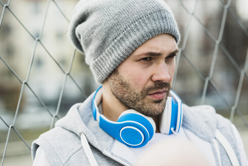 young man with headphones, portrait - UUF003859